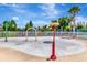 Vibrant splash pad area with colorful water features and a playground in the background at 30445 Tremont Dr, Wesley Chapel, FL 33543
