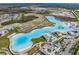 An aerial view of Epperson Lagoon showcases its large size and vibrant blue waters near new construction homes at 30989 Summer Sun Loop, Wesley Chapel, FL 33545