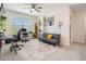 Bright office with two desks, a futon, bookshelf, and a large window for natural light at 30989 Summer Sun Loop, Wesley Chapel, FL 33545