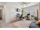 Bright office with two desks, a futon, bookshelf, and a large window for natural light at 30989 Summer Sun Loop, Wesley Chapel, FL 33545