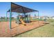 Community playground with slides, swings, and climbing structures offers recreational opportunities at 30989 Summer Sun Loop, Wesley Chapel, FL 33545