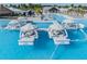 Beautiful community pool featuring cozy private cabanas for relaxing in the sun at 30989 Summer Sun Loop, Wesley Chapel, FL 33545