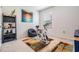 Small workout room featuring an exercise bike, free weights, and a colorful rug at 30989 Summer Sun Loop, Wesley Chapel, FL 33545