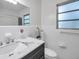 Updated bathroom with sleek vanity, modern fixtures, and a bright, clean aesthetic at 3100 70Th N St, St Petersburg, FL 33710
