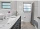 Recently remodeled bathroom featuring a modern vanity, updated shower, and bright lighting at 3100 70Th N St, St Petersburg, FL 33710