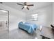 Light-filled bedroom with ceiling fan, study desk, and natural lighting at 3100 70Th N St, St Petersburg, FL 33710