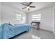 Bright bedroom with a ceiling fan, natural light, and a dedicated study area at 3100 70Th N St, St Petersburg, FL 33710