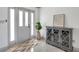 Welcoming foyer featuring a stylish cabinet, decorative accents, and a bright, airy ambiance at 3100 70Th N St, St Petersburg, FL 33710