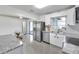 Bright kitchen with stainless steel appliances, updated cabinetry, and adjacent dining area at 3100 70Th N St, St Petersburg, FL 33710
