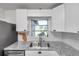 Close up on the sink and counter area of this updated kitchen at 3100 70Th N St, St Petersburg, FL 33710