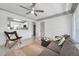 Cozy living room with a kitchen view, comfortable seating, and bright natural light at 3100 70Th N St, St Petersburg, FL 33710