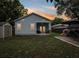 Lovely backyard at dusk featuring a patio, shed, and outdoor seating area at 311 W Ida St, Tampa, FL 33603