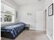 Well-lit bedroom showcases a bed with under-bed storage and a large window at 311 W Ida St, Tampa, FL 33603