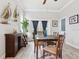Charming dining room with wood floors, a nice wooden table, and decorative sailboat art at 311 W Ida St, Tampa, FL 33603