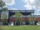 Armature Works exterior features dining, lush landscaping, seating, and a welcoming atmosphere at 311 W Ida St, Tampa, FL 33603