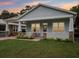 Charming single-story home featuring a inviting front porch and a well-manicured lawn at 311 W Ida St, Tampa, FL 33603