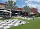Outdoor seating area featuring giant checkers and chess tables, offering a fun and interactive experience at 311 W Ida St, Tampa, FL 33603
