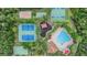 Aerial shot of the community amenities including tennis courts, playground, volleyball, basketball and a pool at 31331 Anniston Dr, Wesley Chapel, FL 33543