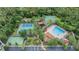 Aerial shot showcases community amenities, including tennis, volleyball, basketball courts, playground, and pool at 31331 Anniston Dr, Wesley Chapel, FL 33543