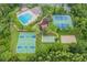 An aerial view of the community's amenities includes a pool, tennis courts, and basketball courts at 31331 Anniston Dr, Wesley Chapel, FL 33543