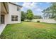 The home features a large backyard with a mature tree line for added privacy at 31331 Anniston Dr, Wesley Chapel, FL 33543