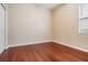 This cozy bedroom features hardwood floors, a window for light, and a closet at 31331 Anniston Dr, Wesley Chapel, FL 33543