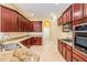 Well-appointed kitchen boasts granite countertops, stainless steel appliances, and ample cabinet space at 31331 Anniston Dr, Wesley Chapel, FL 33543