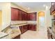Well-equipped kitchen with stainless steel appliances, granite countertops and open floor plan at 31331 Anniston Dr, Wesley Chapel, FL 33543