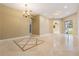 Inviting living room featuring neutral walls and arched doorways at 31331 Anniston Dr, Wesley Chapel, FL 33543
