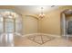 Inviting living room featuring neutral walls and arched doorways at 31331 Anniston Dr, Wesley Chapel, FL 33543