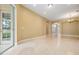 Light-filled living area features tile floors and an open floor plan; a wonderful space to relax and unwind at 31331 Anniston Dr, Wesley Chapel, FL 33543