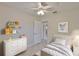 Well-lit bedroom with neutral decor, closet, and access to private bathroom at 3209 W Tyson Ave, Tampa, FL 33611