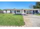 Charming one-story home with a well-manicured lawn and brick-lined landscaping at 3209 W Tyson Ave, Tampa, FL 33611
