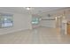 Spacious living area featuring tile floors, large windows, and ample natural light at 3209 W Tyson Ave, Tampa, FL 33611