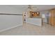 Bright living space that includes laundry, a kitchen, and an open layout at 3209 W Tyson Ave, Tampa, FL 33611