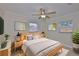 This primary bedroom features natural light, fan, and neutral decor at 3209 W Tyson Ave, Tampa, FL 33611