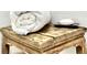 Rustic bathroom stool with rolled towel and soap at 34 Harbor Oaks Cir, Safety Harbor, FL 34695