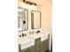 Bathroom featuring dual sinks, modern fixtures, and sleek mirrors for a spa-like experience at 34 Harbor Oaks Cir, Safety Harbor, FL 34695