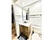 Bathroom features a wooden vanity, modern mirror, white shiplap walls, and a toilet at 34 Harbor Oaks Cir, Safety Harbor, FL 34695