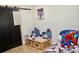 A bedroom featuring a door, wooden desk and a Spiderman theme bed at 34 Harbor Oaks Cir, Safety Harbor, FL 34695