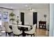 Bright dining room with modern table, comfortable chairs, and plenty of natural light at 34 Harbor Oaks Cir, Safety Harbor, FL 34695