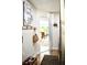 Inviting entryway featuring wood floors and a charming 'Work Hard & Be Nice' wall decor at 34 Harbor Oaks Cir, Safety Harbor, FL 34695
