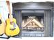 Inviting fireplace with screen and a guitar displayed in the living room at 34 Harbor Oaks Cir, Safety Harbor, FL 34695