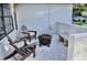 Cozy outdoor patio featuring comfortable seating and a charming stone bench at 34 Harbor Oaks Cir, Safety Harbor, FL 34695