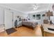 Well-lit bedroom with hardwood floors, ceiling fan and comfortable decor at 3410 Stonehaven E Ct # A, Palm Harbor, FL 34684