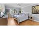 Inviting bedroom with natural light, comfortable bed, and tasteful decor creating a relaxing ambiance at 3410 Stonehaven E Ct # A, Palm Harbor, FL 34684