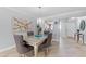 Dining area with a view into the kitchen, perfect for entertaining at 3410 Stonehaven E Ct # A, Palm Harbor, FL 34684