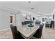 Elegant dining room featuring modern furnishings and chandelier at 3410 Stonehaven E Ct # A, Palm Harbor, FL 34684