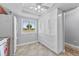 Kitchen featuring spacious cabinets, white appliances and tile flooring at 3410 Stonehaven E Ct # A, Palm Harbor, FL 34684