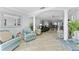 Open-concept living space with comfortable seating and tile floors at 3410 Stonehaven E Ct # A, Palm Harbor, FL 34684